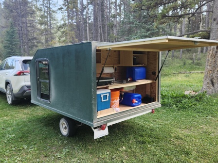 A custom square drop camper trailer.
